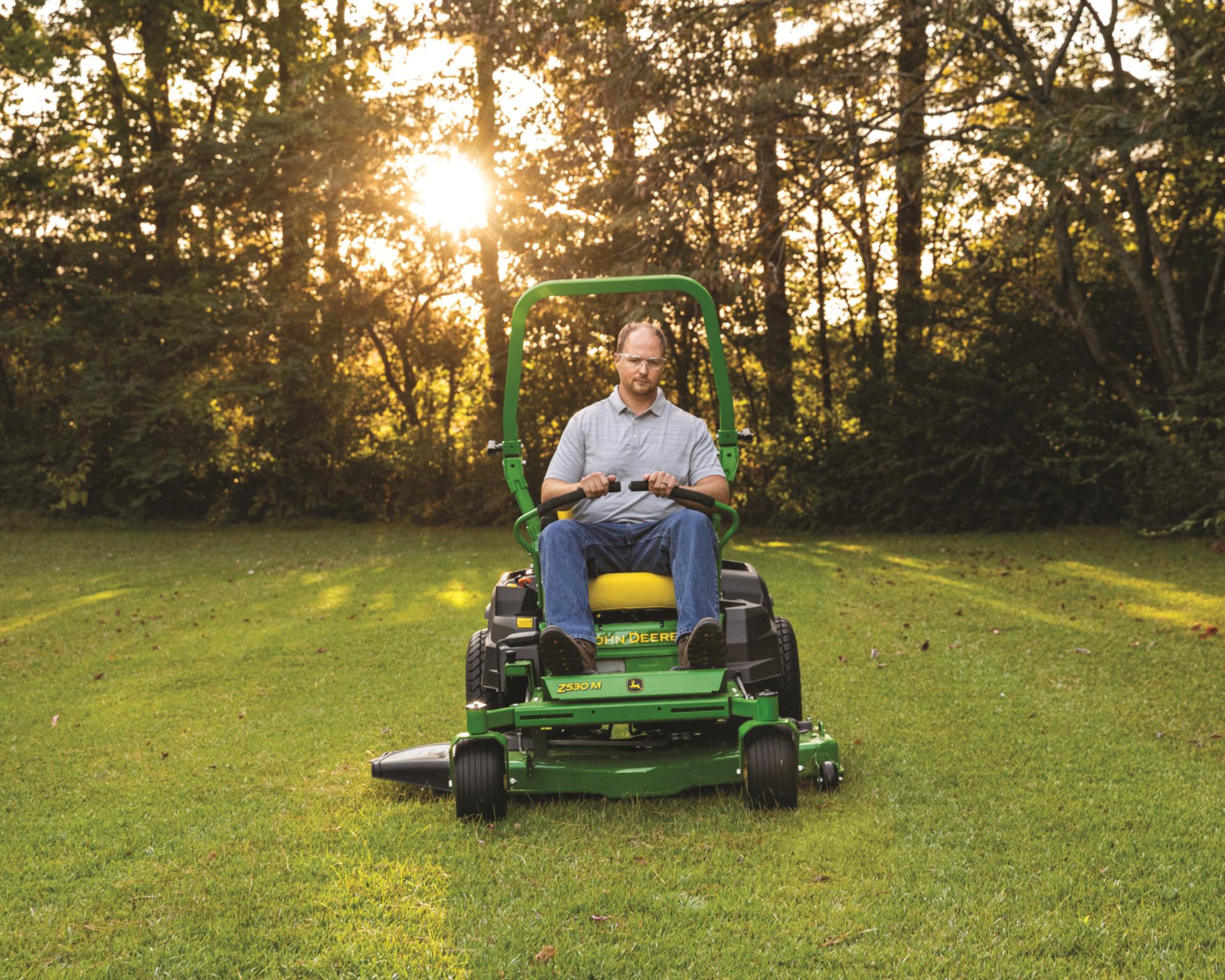 A John Deere Z530M mowing a lawn.