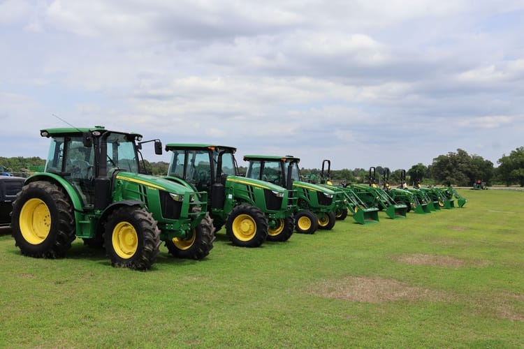 John Deere tractors sit at a dealership in Tennessee.