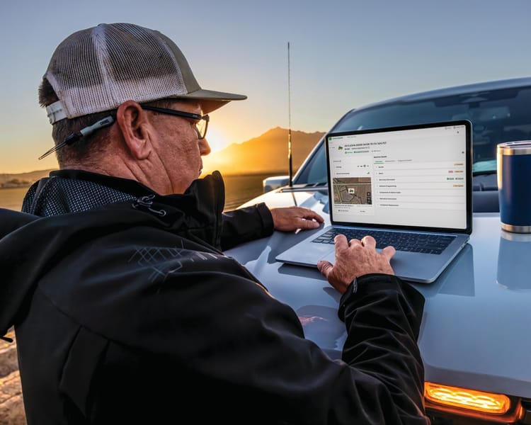 A farmer views his equipment fleet using JDLink.