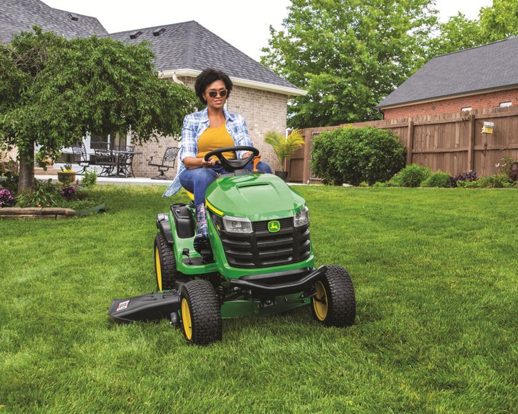 An operator mows their lawn with a S170 Lawn Tractor.