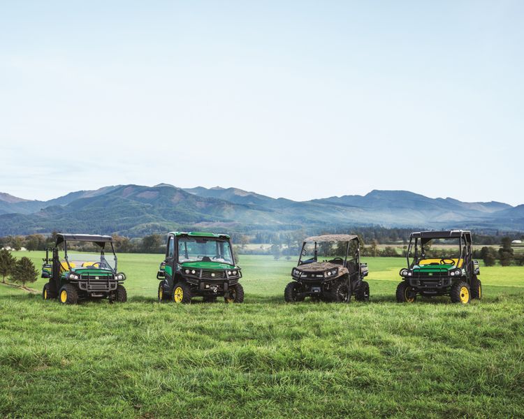 A group shot of Gator UTVs, gas and diesel, in a pasture.