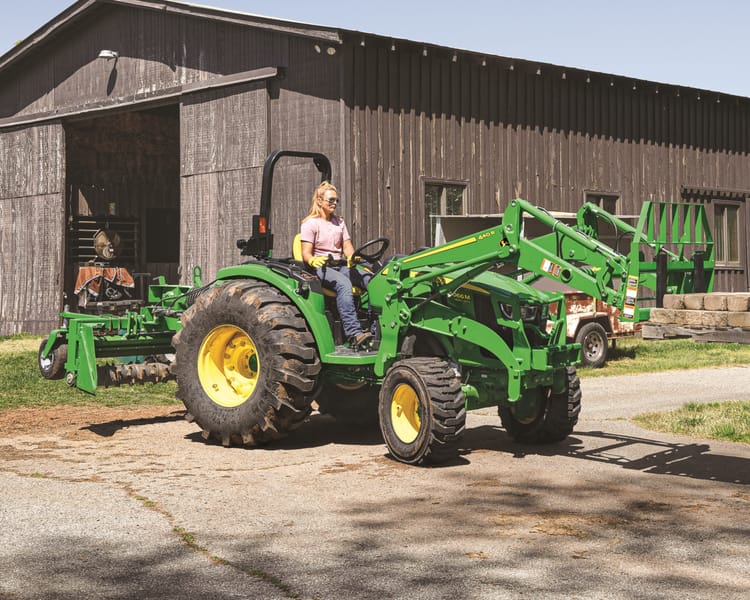 A home owners operates a John Deere 4066M.