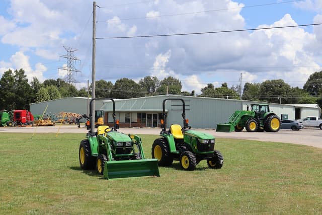 Tennessee Tractor dealership Two John Deere tractors sit in front of a Tennessee Tractor building.