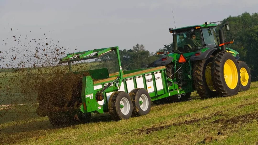 A MS14 manure spreader spreads fertilizer on a field in Memphis, Tennessee.