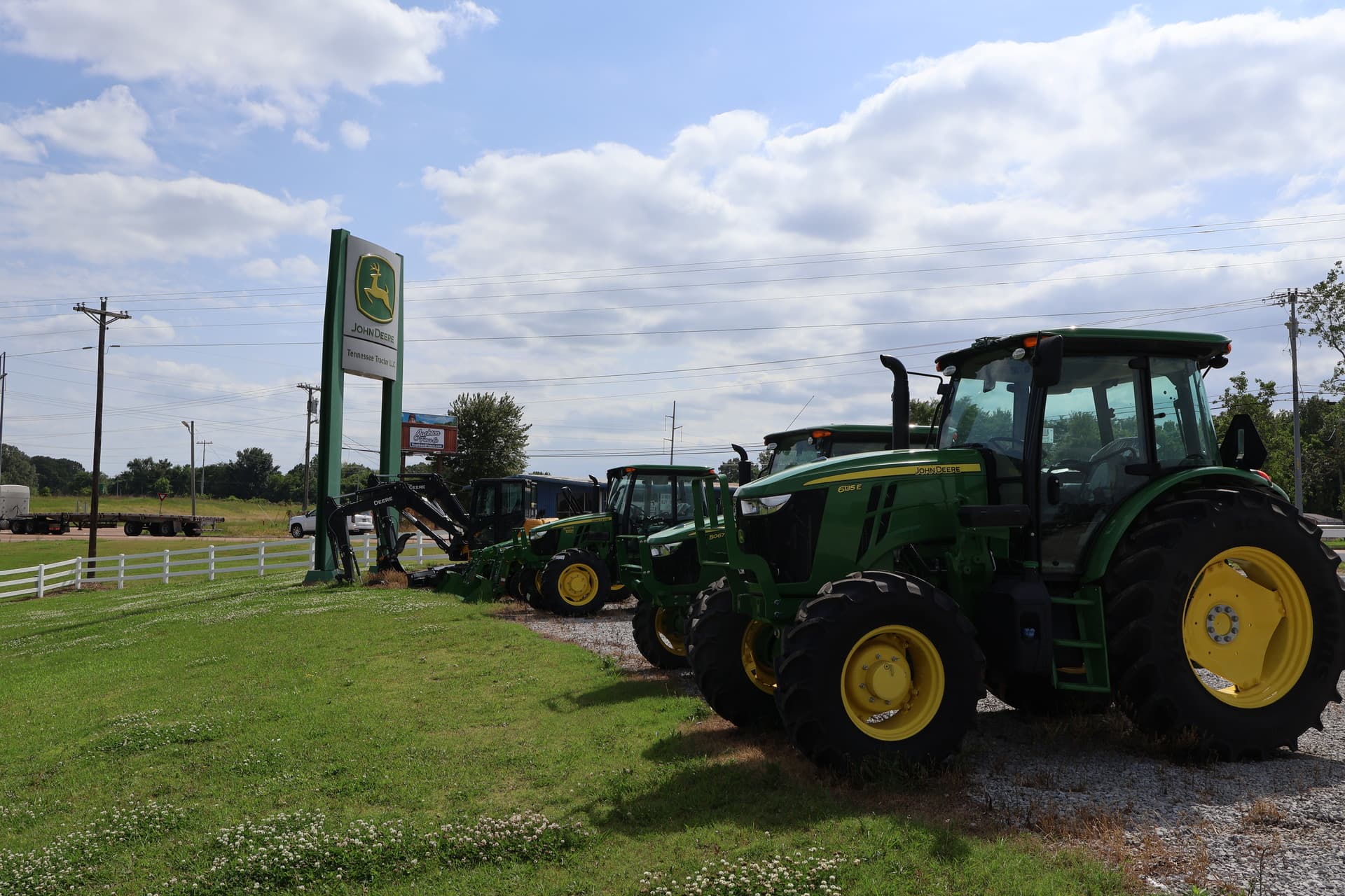 John Deere tractors sit in front of a Tennessee Tractor dealership.