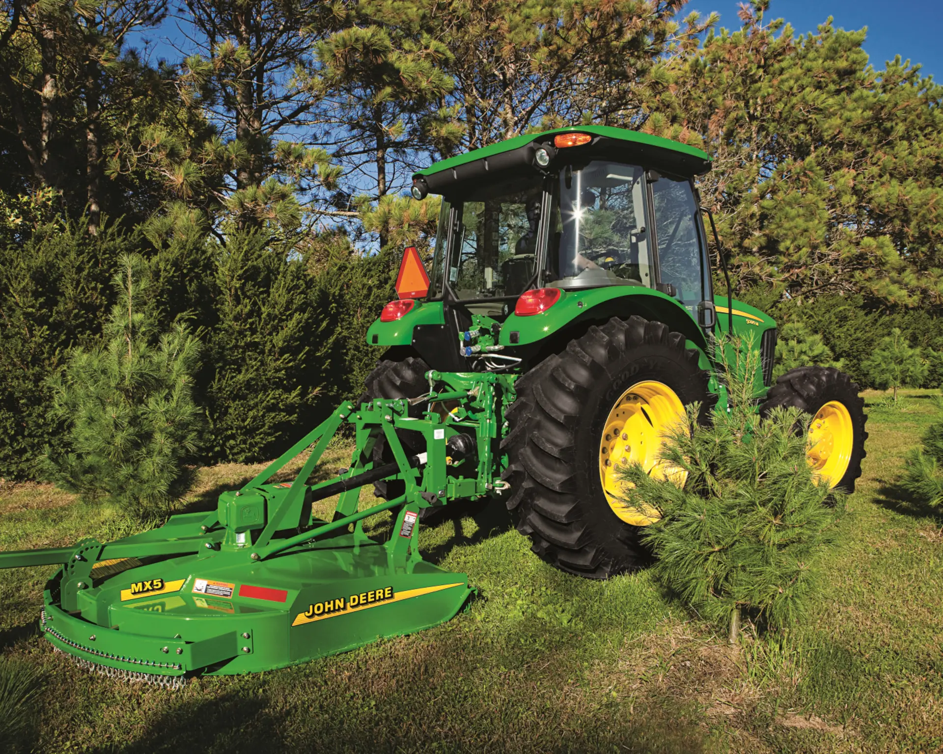 A John Deere tractor with a rotary cutter in Tennessee.