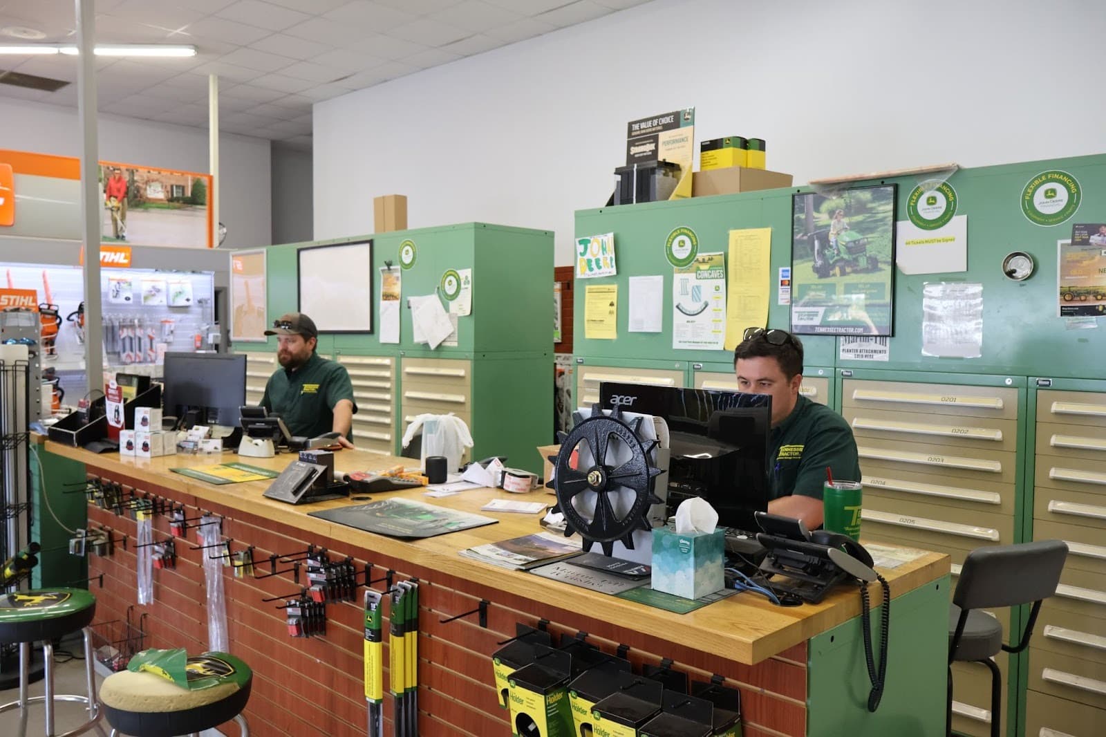 The parts team waits at a counter to help customers at Tennessee Tractor.