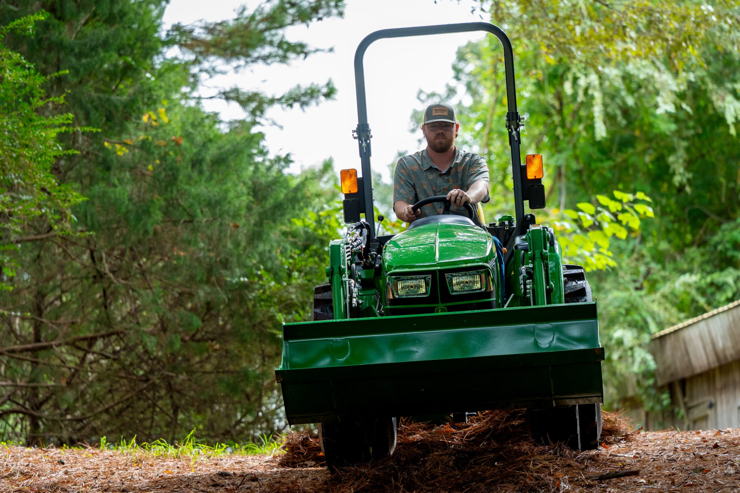 A John Deere tractor operated by a property owner in Tennessee.